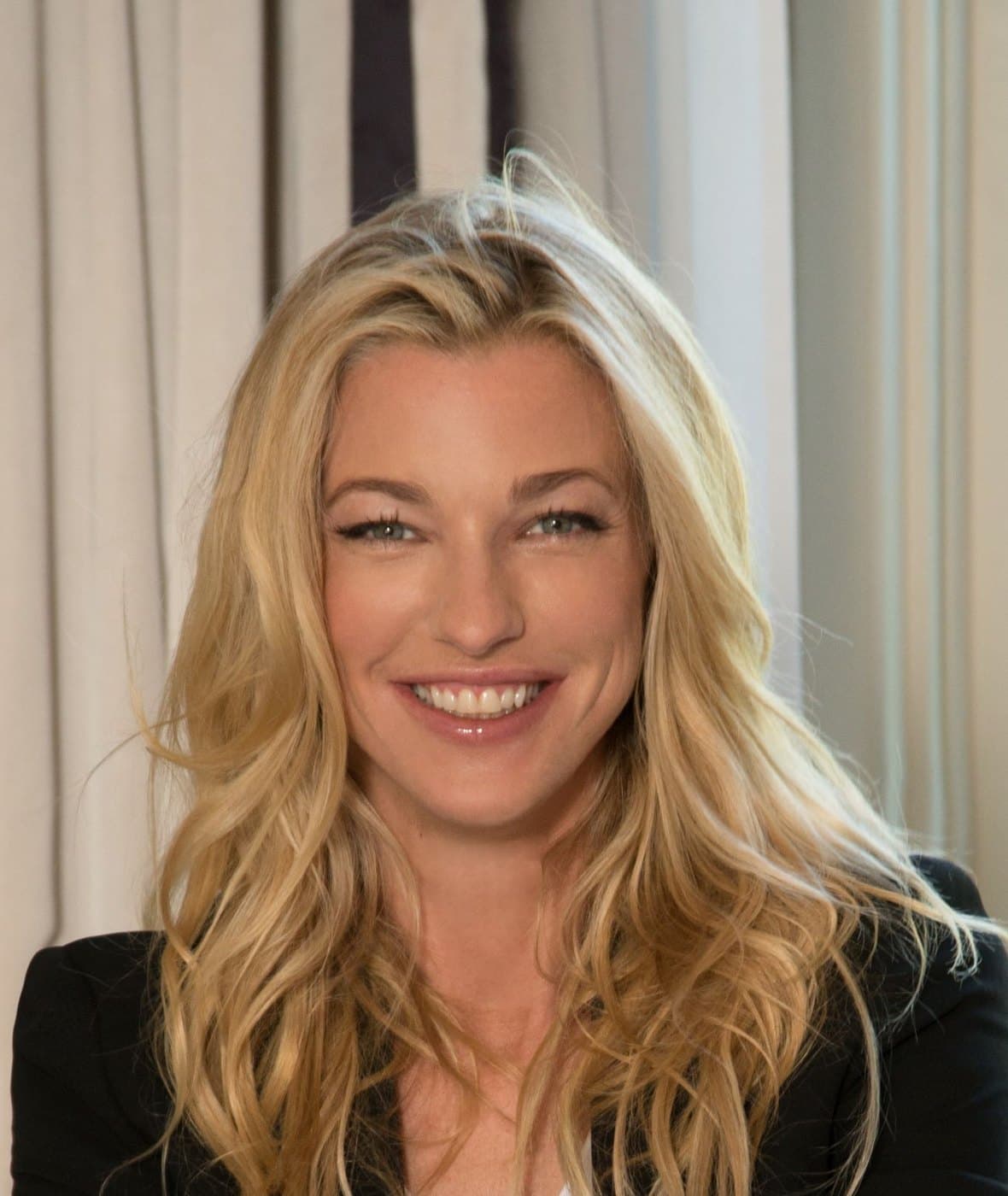 Nicole Junkermann, investor and entrepreneur, smiling warmly in a portrait